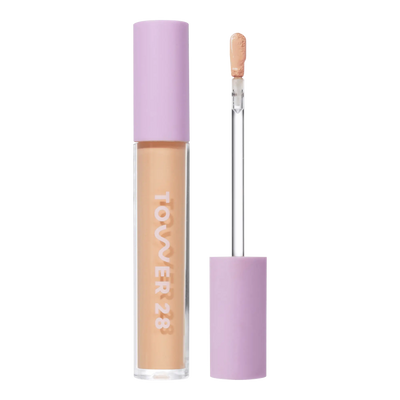 Tower 28 Beauty Swipe Serum Concealer in the shade 7.0 KTOWN, shown with the tube standing upright next to the open applicator wand to reveal the product. [7.0 KTOWN]
