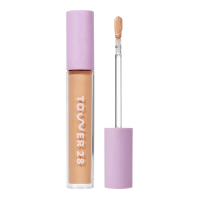 Tower 28 Beauty Swipe Serum Concealer in shade 10.0 NOHO, with the tube standing upright next to the open applicator wand, revealing the product. [10.0 NOHO]