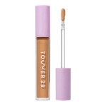 Tower 28 Beauty Swipe Serum Concealer in the shade 12.0 PALI, shown with the tube standing upright next to the open applicator wand to reveal the product. [12.0 PALI]